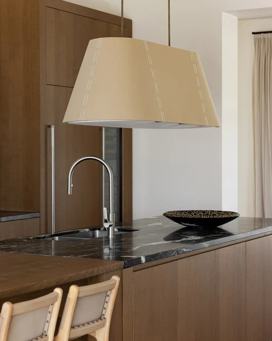 Mid shot of the kitchen in a Red Hill home featuring Bayonne from the PurePanel range on the island cabinetry and matching joinery throughout.